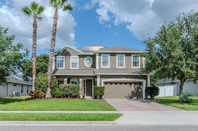 459 Millwood Pl, Winter Garden, FL 34787 - view of front of home with aphalt driveway, a garage, a front lawn, and stucco siding