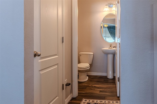 459 Millwood Pl, Winter Garden, FL 34787 - bathroom featuring toilet, baseboards, a sink, and wood finished floors