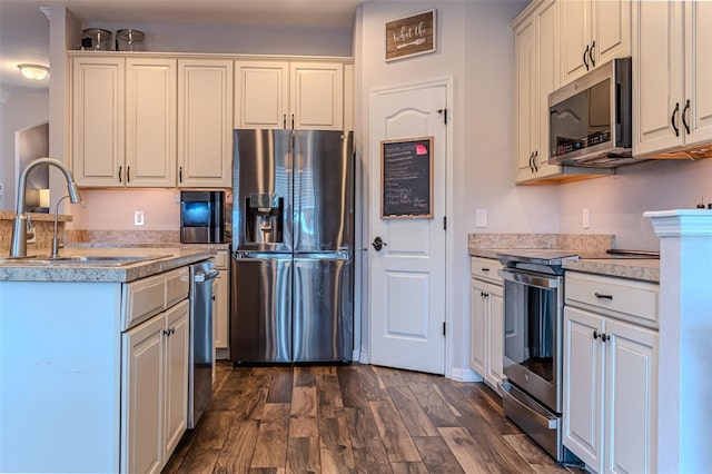 459 Millwood Pl, Winter Garden, FL 34787 - kitchen with light countertops, stainless steel appliances, dark wood-type flooring, and a sink