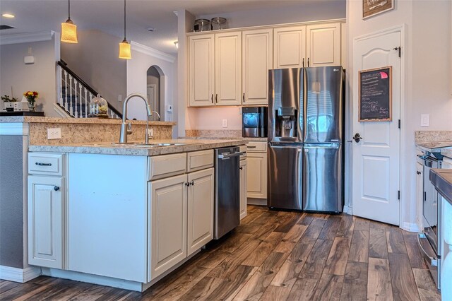 459 Millwood Pl, Winter Garden, FL 34787 - kitchen featuring appliances with stainless steel finishes, ornamental molding, arched walkways, dark wood-style flooring, and light countertops