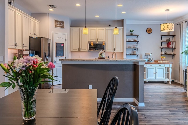 459 Millwood Pl, Winter Garden, FL 34787 - kitchen featuring decorative light fixtures, recessed lighting, open shelves, and appliances with stainless steel finishes