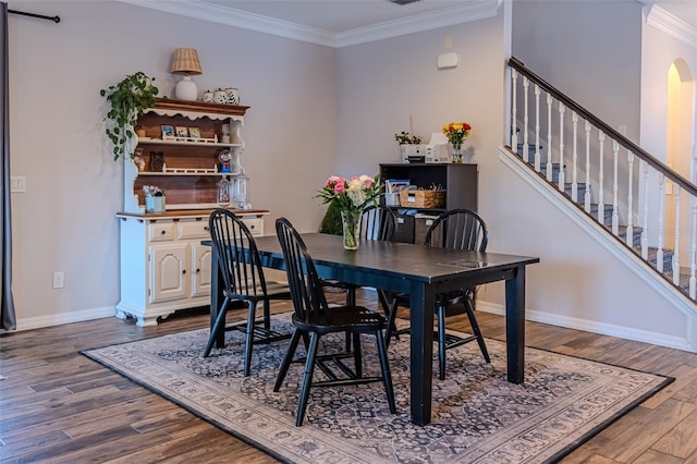459 Millwood Pl, Winter Garden, FL 34787 - dining room featuring dark wood-type flooring, baseboards, stairway, arched walkways, and ornamental molding