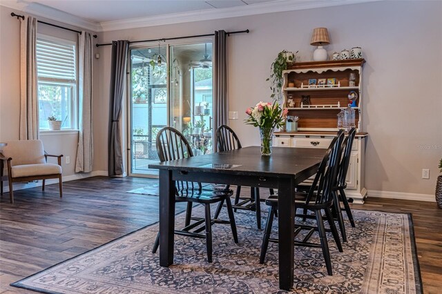 459 Millwood Pl, Winter Garden, FL 34787 - dining room with baseboards, dark wood finished floors, and crown molding