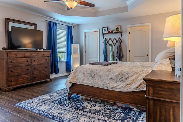 459 Millwood Pl, Winter Garden, FL 34787 - bedroom with ornamental molding, dark wood-type flooring, a ceiling fan, a raised ceiling, and baseboards