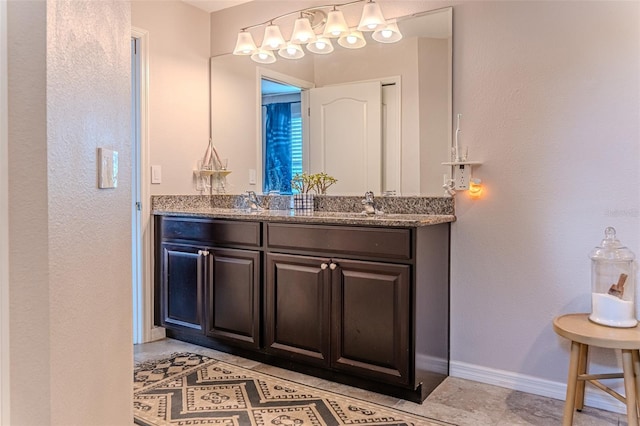 459 Millwood Pl, Winter Garden, FL 34787 - full bathroom featuring double vanity, baseboards, and a sink