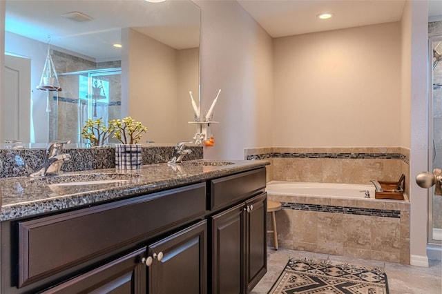 459 Millwood Pl, Winter Garden, FL 34787 - bathroom featuring a sink, double vanity, a stall shower, and a bath