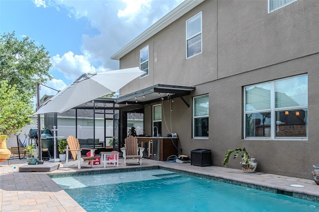 459 Millwood Pl, Winter Garden, FL 34787 - rear view of property with stucco siding, a fenced in pool, and a patio