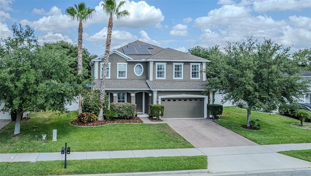 459 Millwood Pl, Winter Garden, FL 34787 - craftsman inspired home featuring roof mounted solar panels, a garage, stucco siding, a front lawn, and driveway