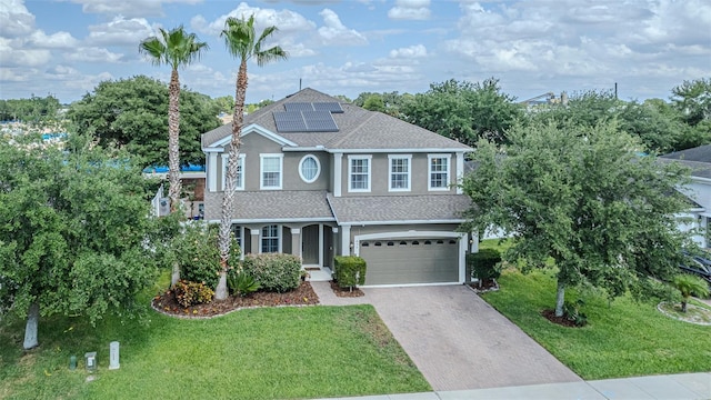 459 Millwood Pl, Winter Garden, FL 34787 - craftsman inspired home featuring a garage, stucco siding, a front lawn, concrete driveway, and solar panels