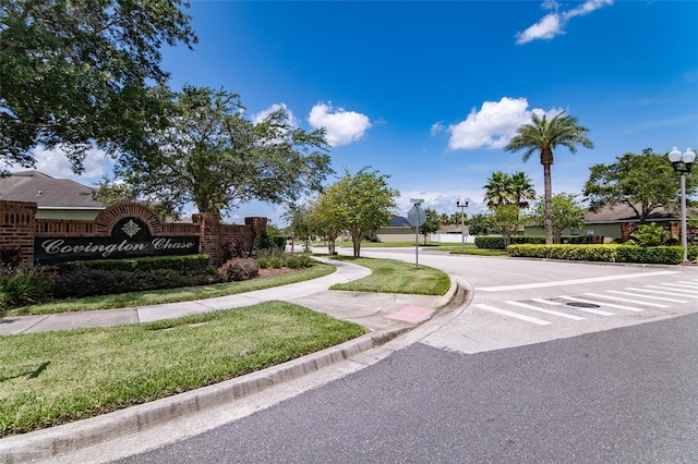 459 Millwood Pl, Winter Garden, FL 34787 - view of asphalt street featuring traffic signs, sidewalks, curbs, and street lights