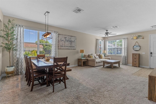 570 Cascading Creek Ln, Winter Garden, FL 34787 - carpeted dining area featuring ceiling fan, baseboards, and a textured ceiling