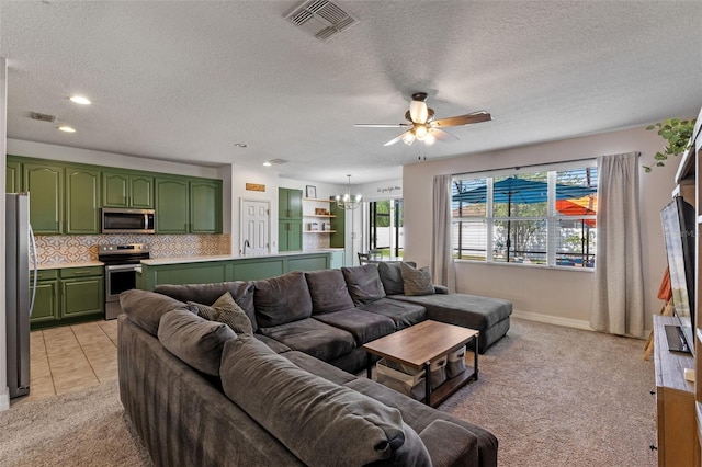 570 Cascading Creek Ln, Winter Garden, FL 34787 - living area with a chandelier, ceiling fan, a textured ceiling, light carpet, and recessed lighting