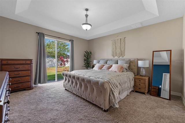 570 Cascading Creek Ln, Winter Garden, FL 34787 - bedroom featuring light carpet, access to outside, a raised ceiling, and baseboards