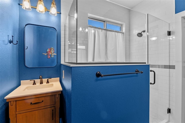 570 Cascading Creek Ln, Winter Garden, FL 34787 - bathroom featuring a shower stall, a textured wall, and vanity