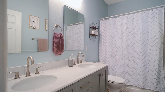 570 Cascading Creek Ln, Winter Garden, FL 34787 - bathroom featuring toilet and double vanity
