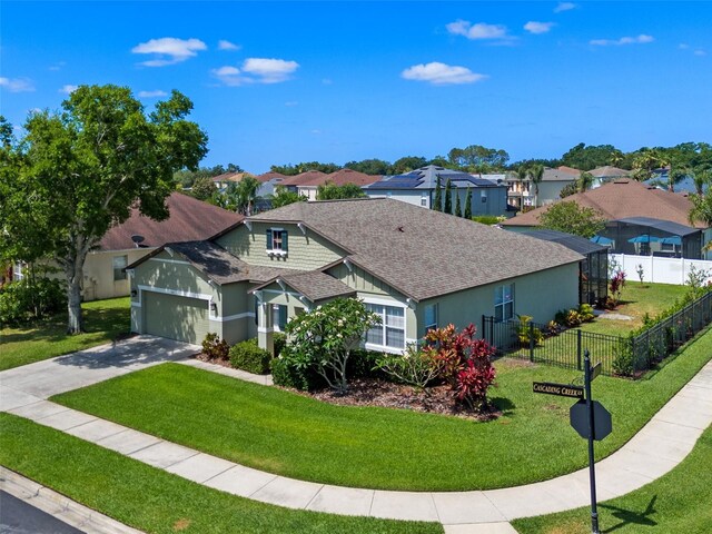 570 Cascading Creek Ln, Winter Garden, FL 34787 - view of front of house featuring a shingled roof, a residential view, an attached garage, driveway, and stucco siding