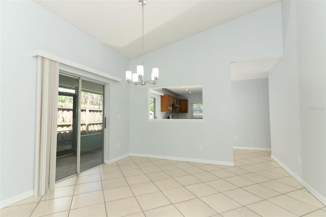 unfurnished room with a chandelier, light tile patterned flooring, baseboards, and high vaulted ceiling