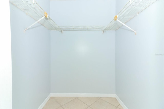 spacious closet with light tile patterned flooring