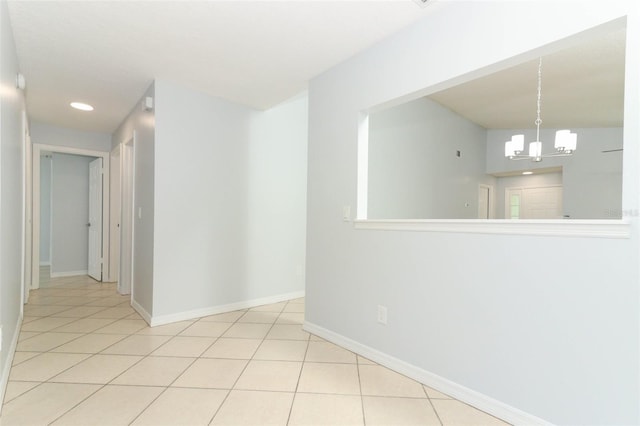 unfurnished room with a chandelier, baseboards, tile patterned flooring, and recessed lighting
