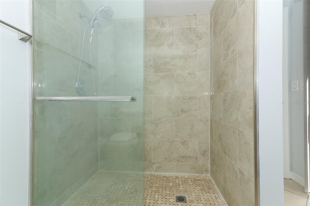 bathroom featuring a stall shower and tile patterned flooring