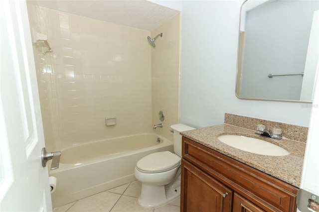 full bath with tile patterned floors, toilet, vanity, and washtub / shower combination