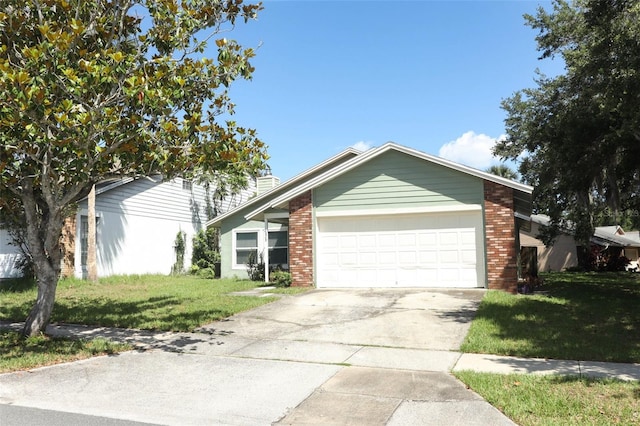 single story home with a garage, a front yard, brick siding, and concrete driveway