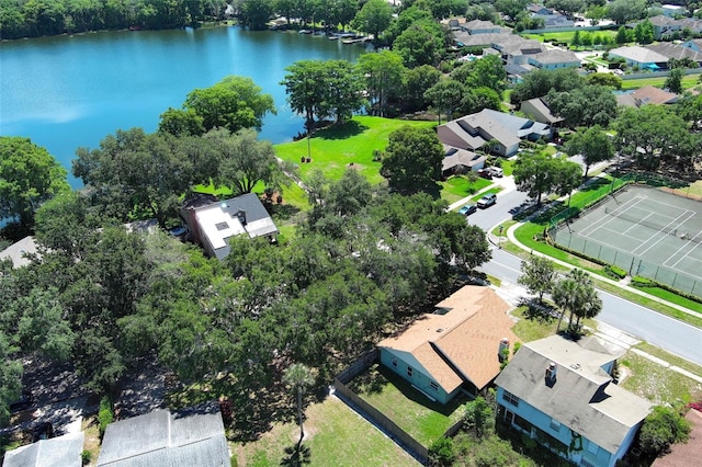 aerial view of residential area with a large body of water