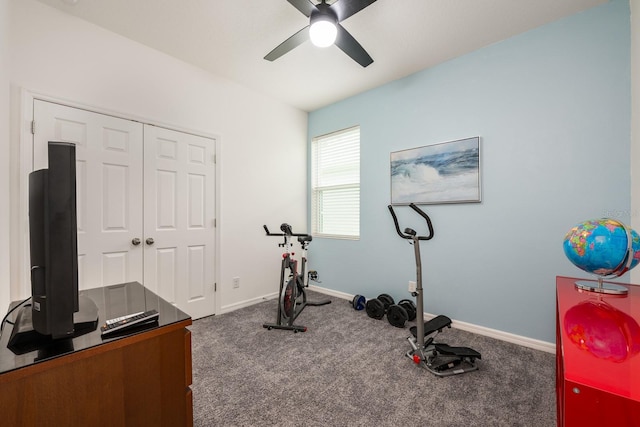 exercise room featuring a ceiling fan, carpet, and baseboards