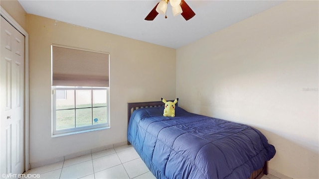 bedroom featuring tile patterned floors and a ceiling fan