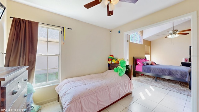 2108 Shannon Lakes Blvd, Kissimmee, FL 34743 - bedroom with multiple windows, light tile patterned floors, and ceiling fan