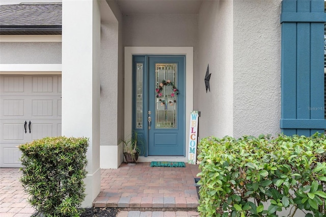 doorway to property with stucco siding