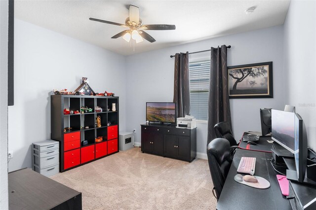 office featuring ceiling fan and light colored carpet