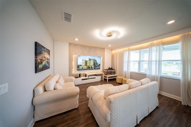 1631 Pontiff Pl, Davenport, FL 33896 - living area featuring baseboards, dark wood-style flooring, recessed lighting, and an accent wall