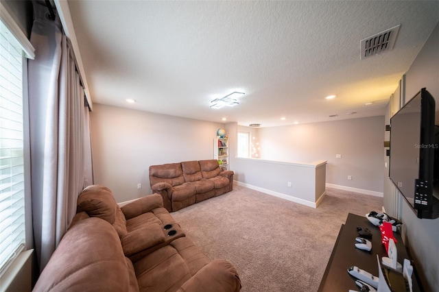 1631 Pontiff Pl, Davenport, FL 33896 - living room featuring light carpet, recessed lighting, baseboards, and a textured ceiling