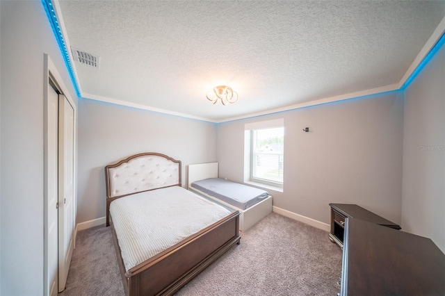 1631 Pontiff Pl, Davenport, FL 33896 - carpeted bedroom with a textured ceiling, a closet, baseboards, and crown molding