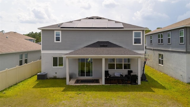 1631 Pontiff Pl, Davenport, FL 33896 - rear view of house featuring roof mounted solar panels, a patio, cooling unit, a shingled roof, and stucco siding