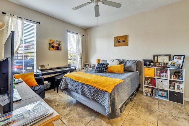 bedroom with tile patterned floors and a ceiling fan