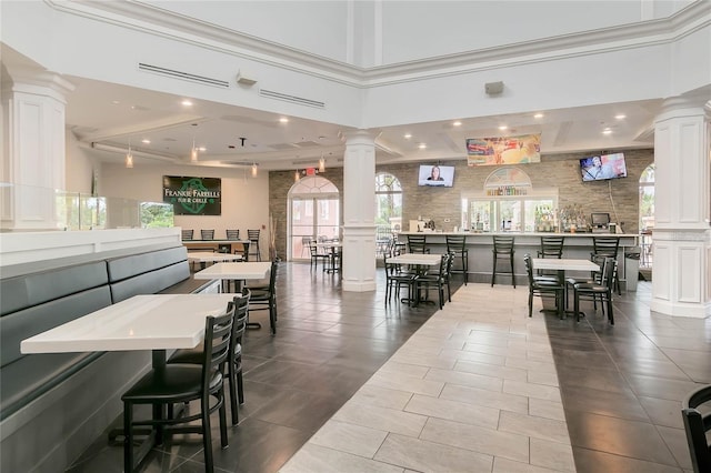 interior space with plenty of natural light and decorative columns