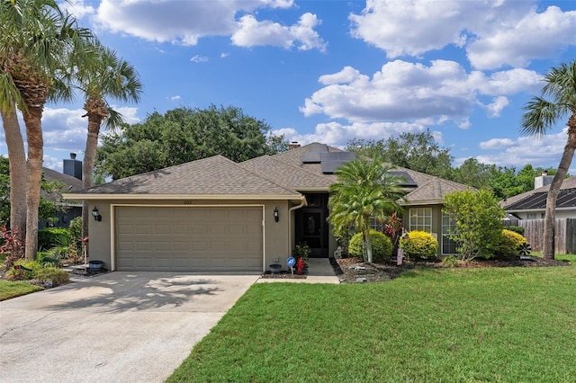 single story home with an attached garage, concrete driveway, stucco siding, a front lawn, and solar panels