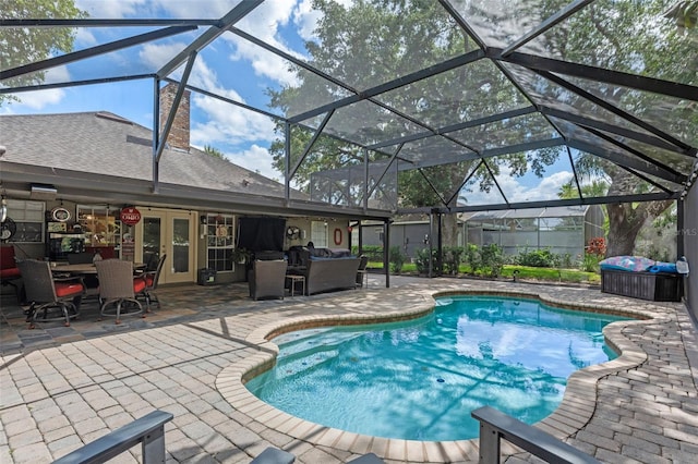 pool with french doors, a patio, a lanai, and outdoor dining area