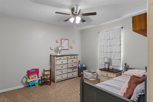 bedroom featuring light colored carpet, a textured ceiling, and a ceiling fan