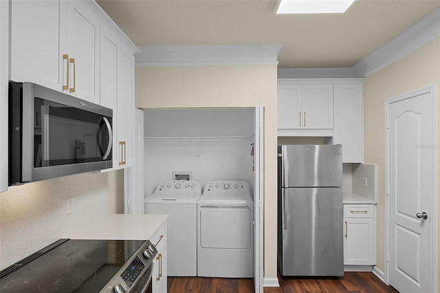 kitchen featuring white cabinetry, light countertops, stainless steel appliances, and separate washer and dryer