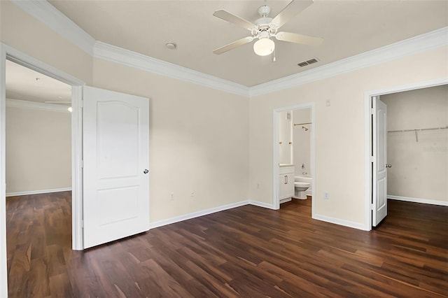 unfurnished bedroom featuring crown molding, baseboards, visible vents, and wood finished floors