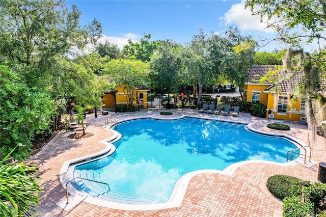 community pool featuring a patio area