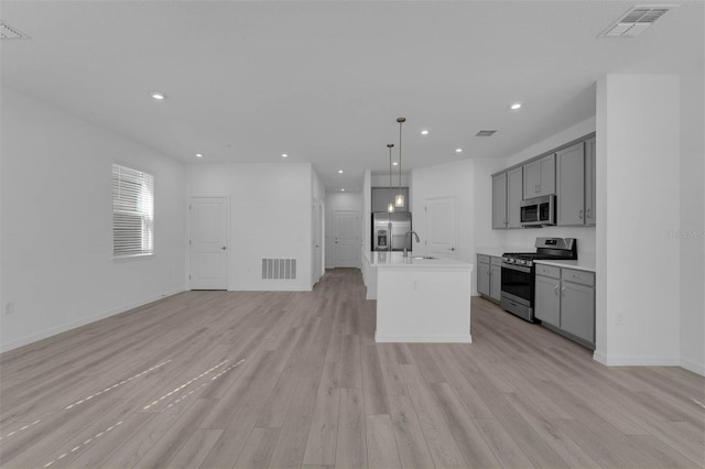 305 Platform Ln, Debary, FL 32713 - kitchen featuring open floor plan, stainless steel appliances, a sink, and gray cabinets