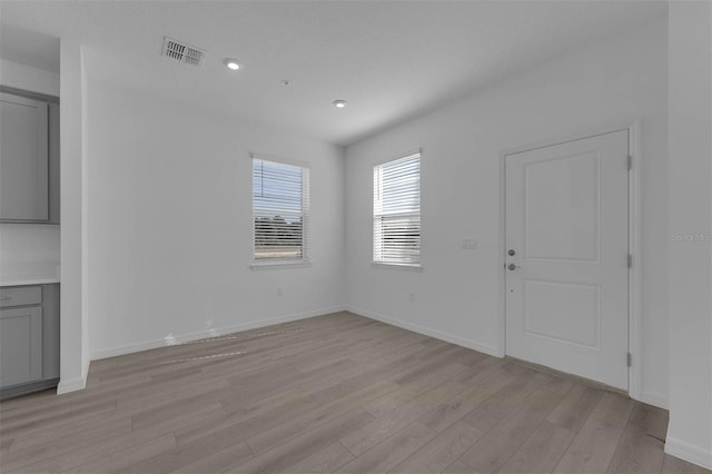 305 Platform Ln, Debary, FL 32713 - unfurnished living room featuring baseboards, light wood-type flooring, visible vents, and recessed lighting
