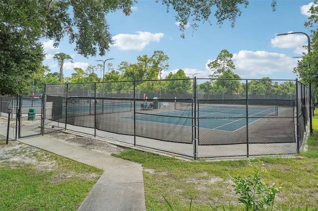 305 Platform Ln, Debary, FL 32713 - view of tennis court with a gate and fence