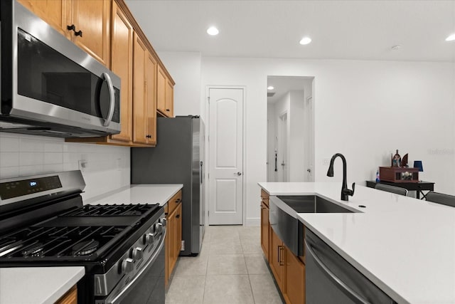 2524 Datura Loop, Saint Cloud, FL 34772 - kitchen featuring appliances with stainless steel finishes, a sink, backsplash, light countertops, and recessed lighting