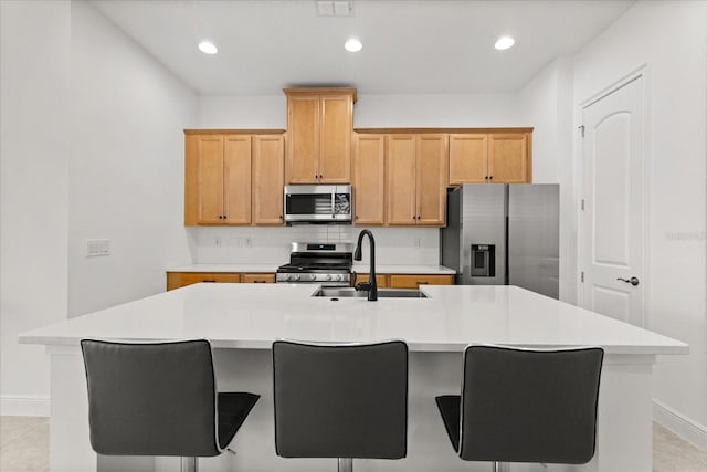 2524 Datura Loop, Saint Cloud, FL 34772 - kitchen with appliances with stainless steel finishes, baseboards, a sink, an island with sink, and recessed lighting