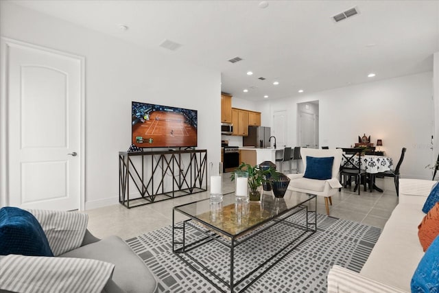 2524 Datura Loop, Saint Cloud, FL 34772 - living room with light tile patterned floors, recessed lighting, and baseboards